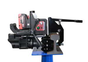 Portable rail drilling machine used for accurate hole placement in crane rail sole plates during industrial installation